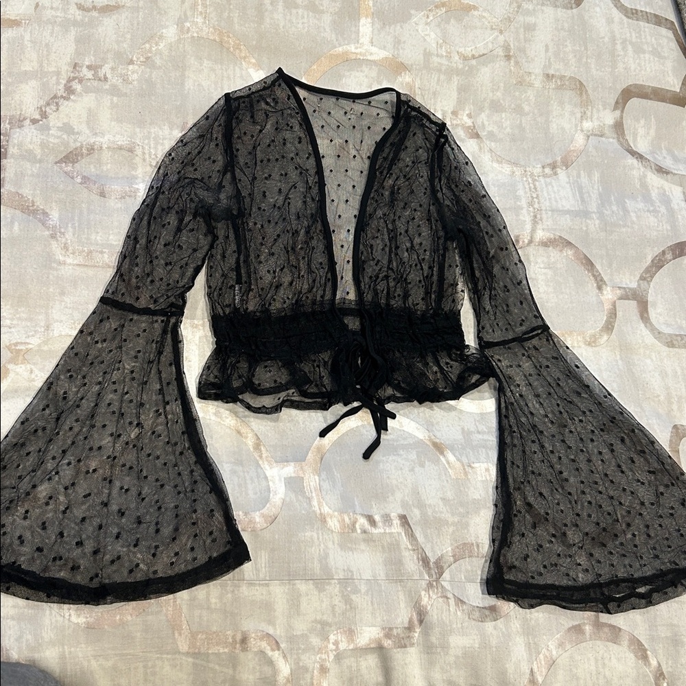BEAUTIFUL VINTAGE SHEER BLACK DOT 
TOP WITH TRUMPET SLEEVES.